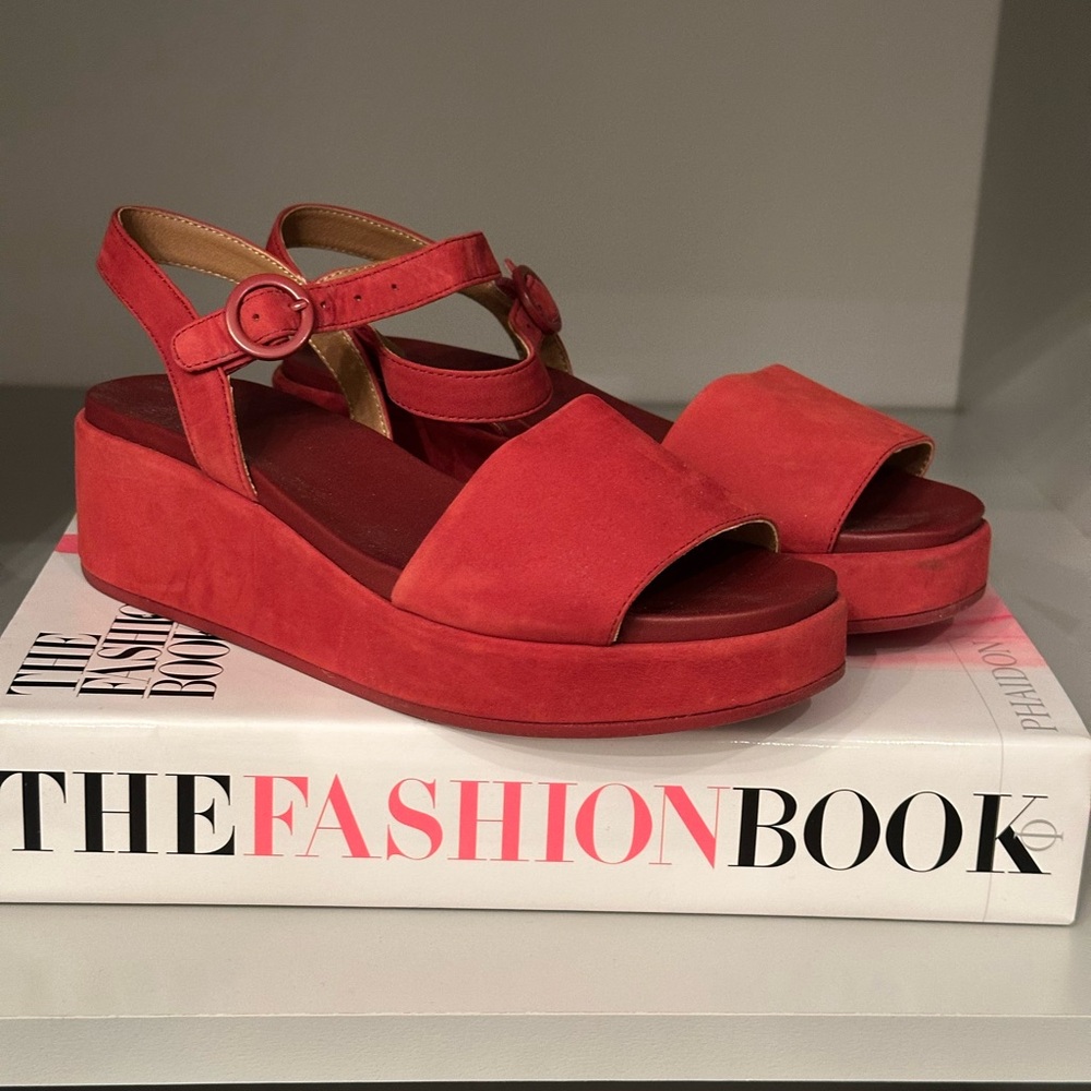 Red suede sandals.